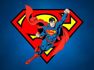 Superman Flying in Front of the Classic DC Comics Logo on a Blue Background HD wallpaper