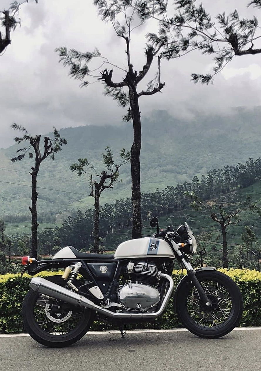 Royal Enfield Continental GT 650 White Motorcycle Parked Against Misty Mountain Landscape HD phone wallpaper
