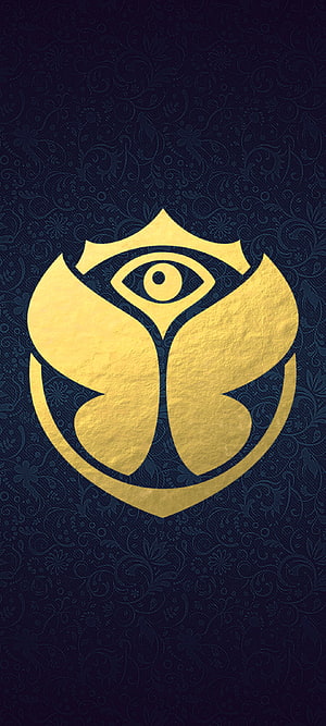 Tomorrowland Festival Golden Eye Logo on Dark Blue Floral Pattern Background HD phone wallpaper