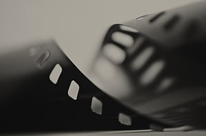 Cinematic Black and White Film Strip Close-Up with Shallow Depth of Field HD wallpaper
