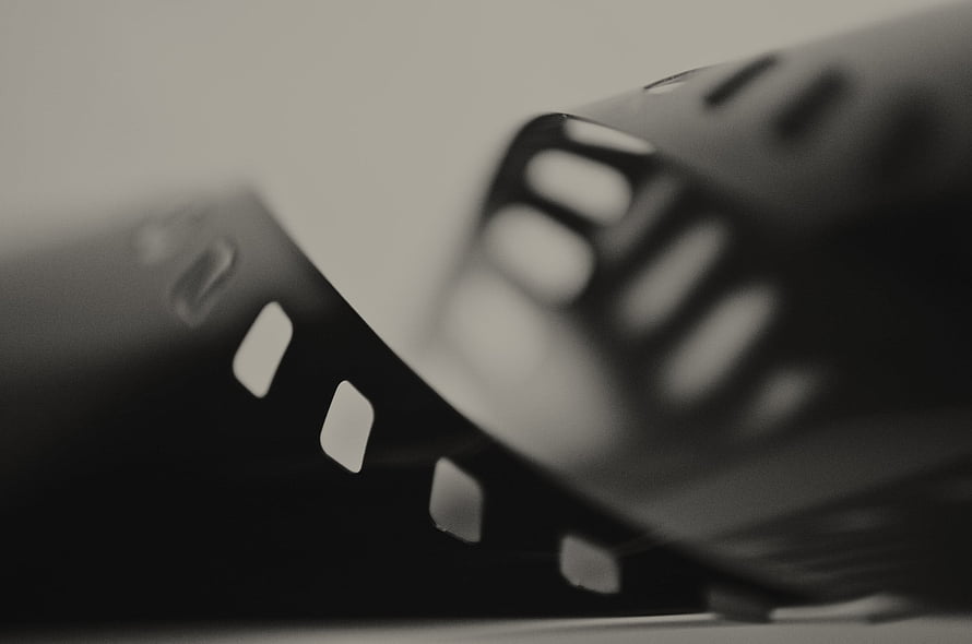 Cinematic Black and White Film Strip Close-Up with Shallow Depth of Field HD wallpaper