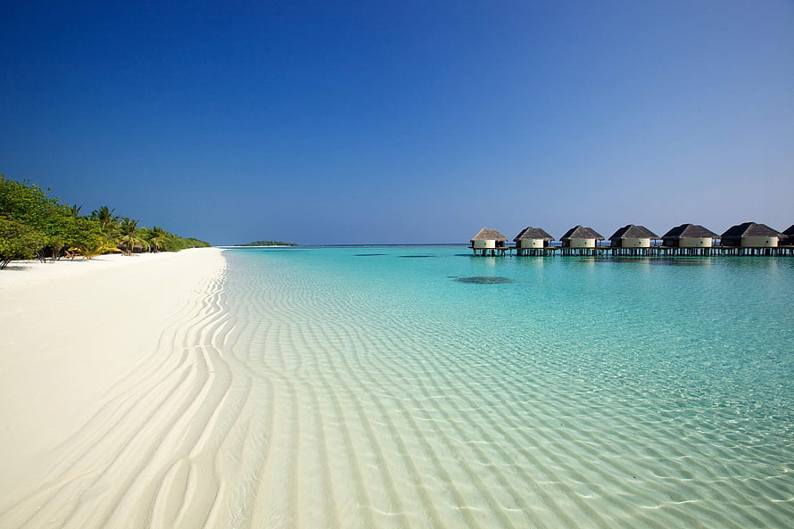 Tropical Island Beach With Overwater Bungalows And Turquoise Lagoon HD wallpaper