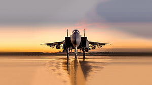 Military Fighter Jet on Wet Runway at Golden Hour Sunset HD wallpaper