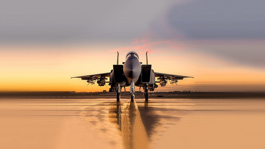 Military Fighter Jet on Wet Runway at Golden Hour Sunset HD wallpaper