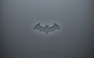 Minimalist Batman Emblem Cutout on Textured Gray Surface HD wallpaper
