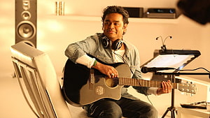 A R Rahman Playing Acoustic Guitar in Recording Studio HD wallpaper