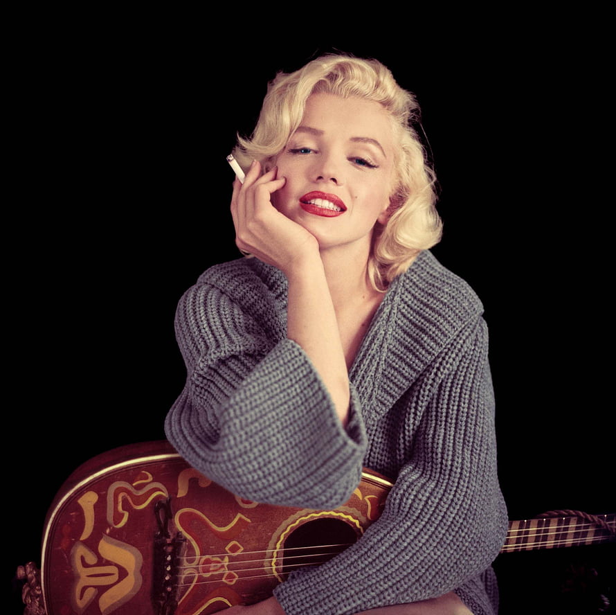 Marilyn Monroe Portrait with Guitar and Cigarette in Grey Knit Sweater HD wallpaper