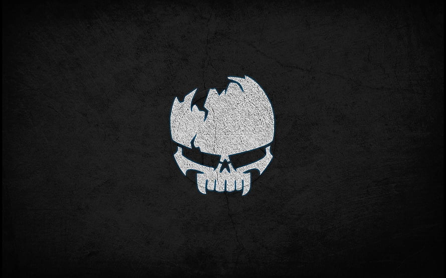 Gothic Skull Emblem with Fiery Crest on Dark Textured Background HD wallpaper