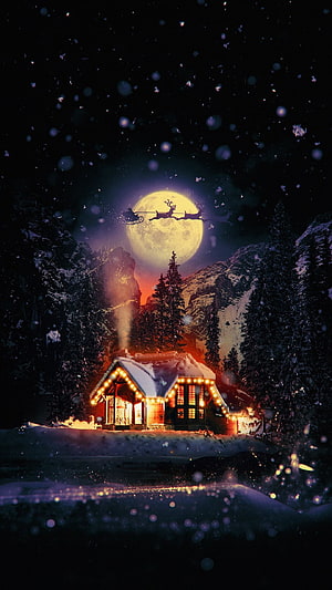Santa Claus flying over a cozy cabin under a full moon on a snowy Christmas night HD phone wallpaper