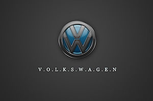 Volkswagen Emblem on Dark Background with Metallic Chrome and Blue Accents HD wallpaper