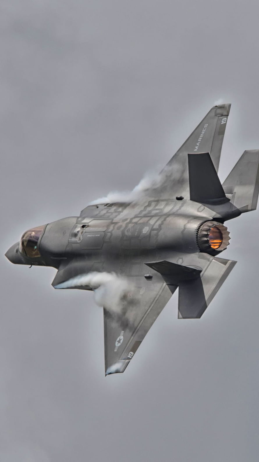 Lockheed Martin F-35 Lightning II fighter jet in flight with afterburner and vapor trail HD phone wallpaper