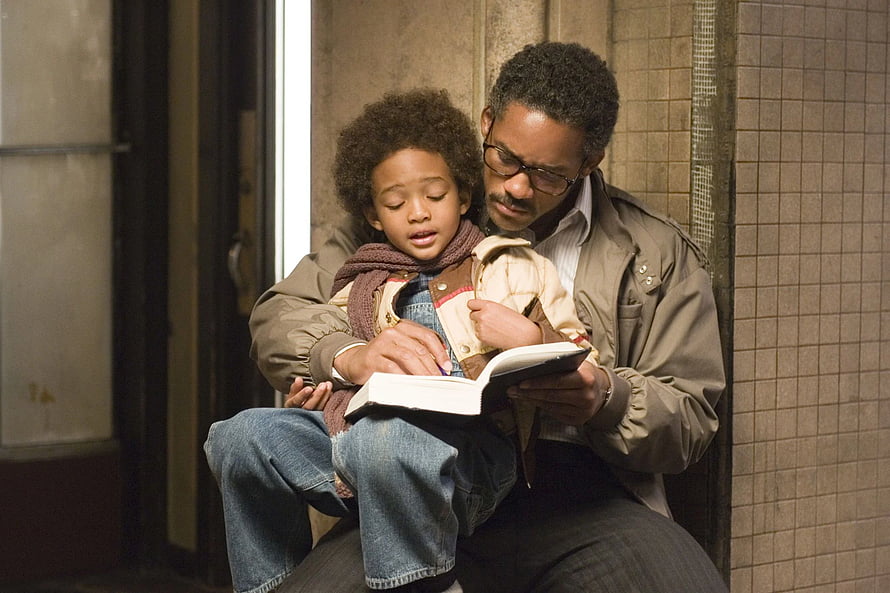 The Pursuit of Happyness: Father and Son Reading Together in a Quiet Moment HD wallpaper