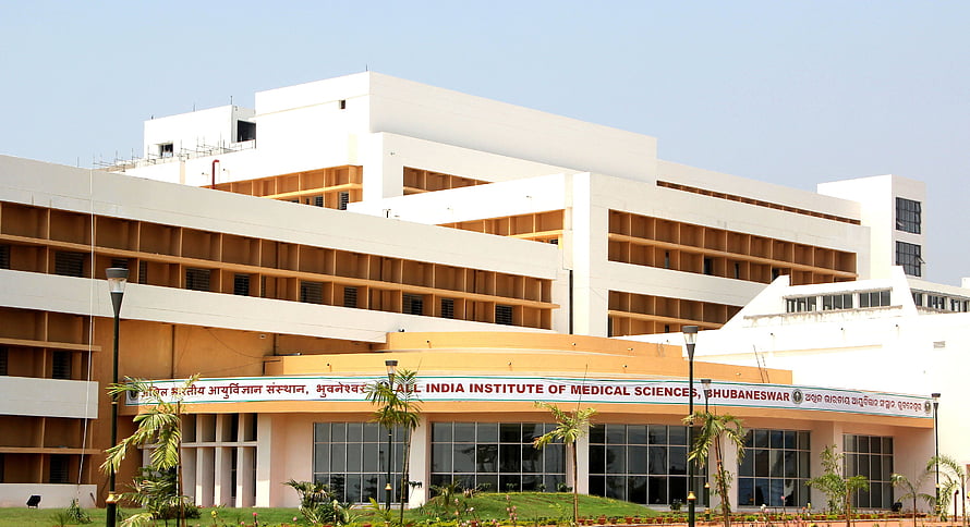 AIIMS Bhubaneswar Main Building Exterior with Tropical Landscaping HD wallpaper