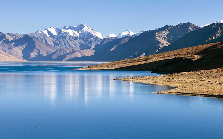 Serene High-Altitude Lake with Snow-Capped Himalayan Peaks in Ladakh HD wallpaper