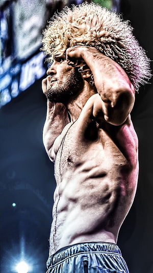 Khabib Nurmagomedov UFC Fighter Portrait with Curly Blonde Hair and Muscular Physique HD phone wallpaper
