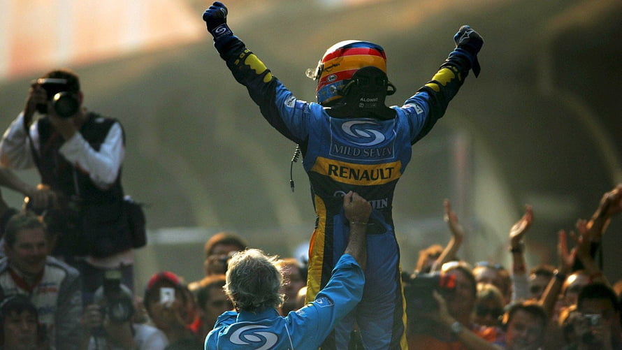 Fernando Alonso Celebrates Victory in Renault Mild Seven Racing Suit HD wallpaper