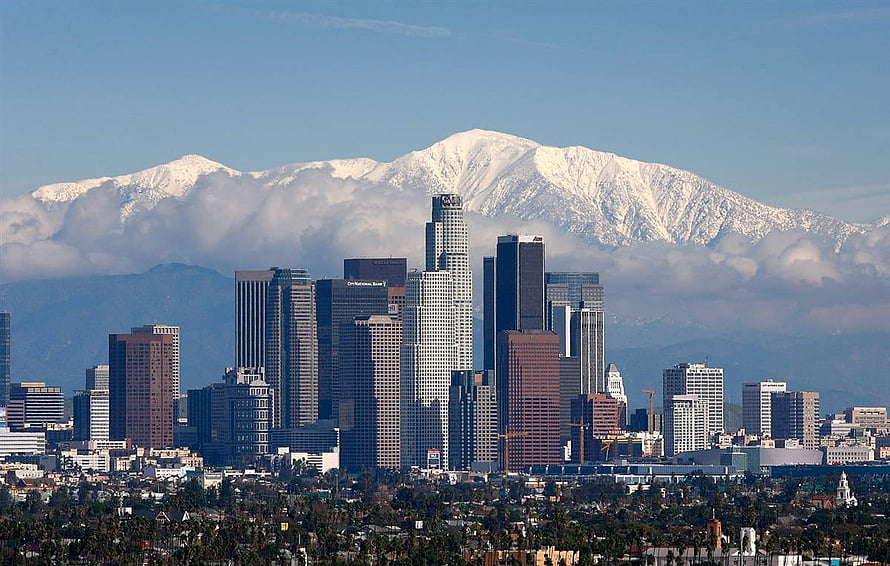Los Angeles Downtown Skyline Framed by Snow-Capped San Gabriel Mountains HD wallpaper