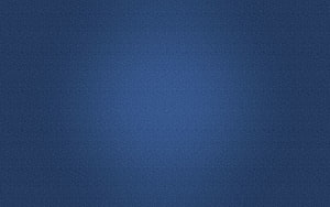 Minimalist Dark Blue Gradient Texture with Soft Central Glow and Subtle Film Grain HD wallpaper