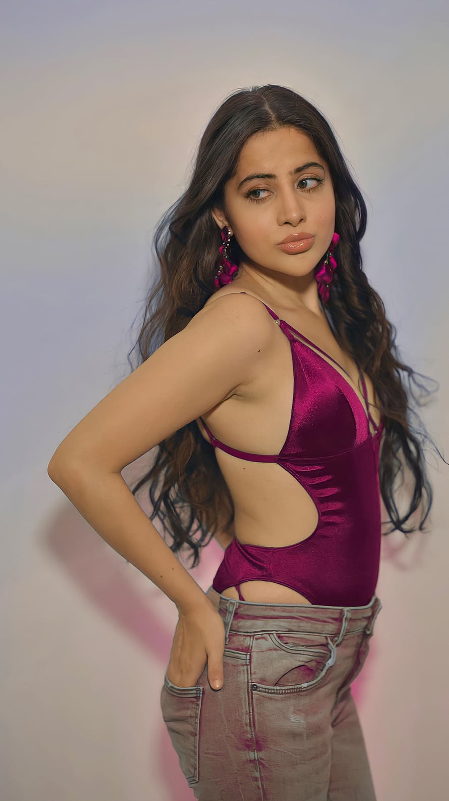 Urfi Javed in a magenta satin bodysuit with distressed jeans and statement earrings HD phone wallpaper