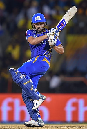 Rohit Sharma in Mumbai Indians blue kit executing a powerful cricket batting shot HD phone wallpaper