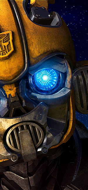Bumblebee Close-Up Portrait with Glowing Blue Eye and Autobot Emblem HD phone wallpaper