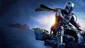 The Mandalorian and Grogu Riding a Speeder Bike Through a Desert at Sunset HD wallpaper