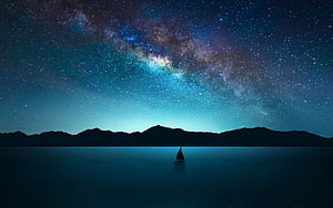 Milky Way Galaxy Arching Over a Serene Lake with a Silhouetted Sailboat and Distant Mountains HD wallpaper