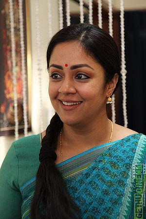 Jyothika in a teal sari with gold jewelry and a long braid HD phone wallpaper