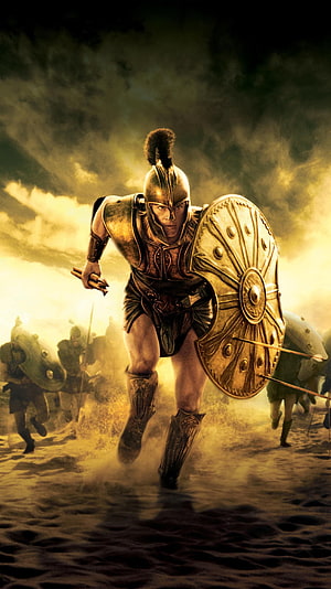 Spartan Warrior Charging Into Battle in Golden Dust and Smoke HD phone wallpaper
