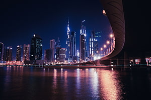 Dubai Marina Night Skyline with Burj Khalifa and Curved Bridge Reflections HD wallpaper