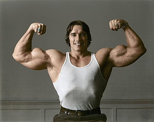 Arnold Schwarzenegger Front Double Biceps Pose in White Tank Top HD wallpaper