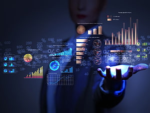 Business Professional Interacting with Holographic Financial Data Dashboard HD wallpaper