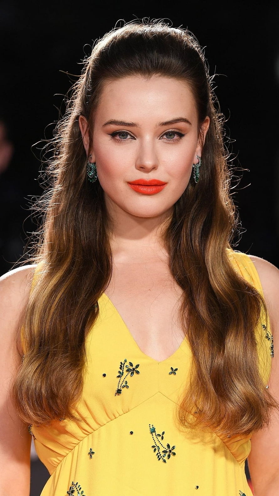 Katherine Langford in Yellow Embroidered Dress with Emerald Earrings and Red Lipstick HD phone wallpaper