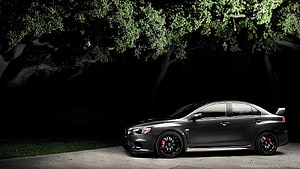 Mitsubishi Lancer Evolution X Sedan Parked Under Illuminated Trees at Night HD wallpaper