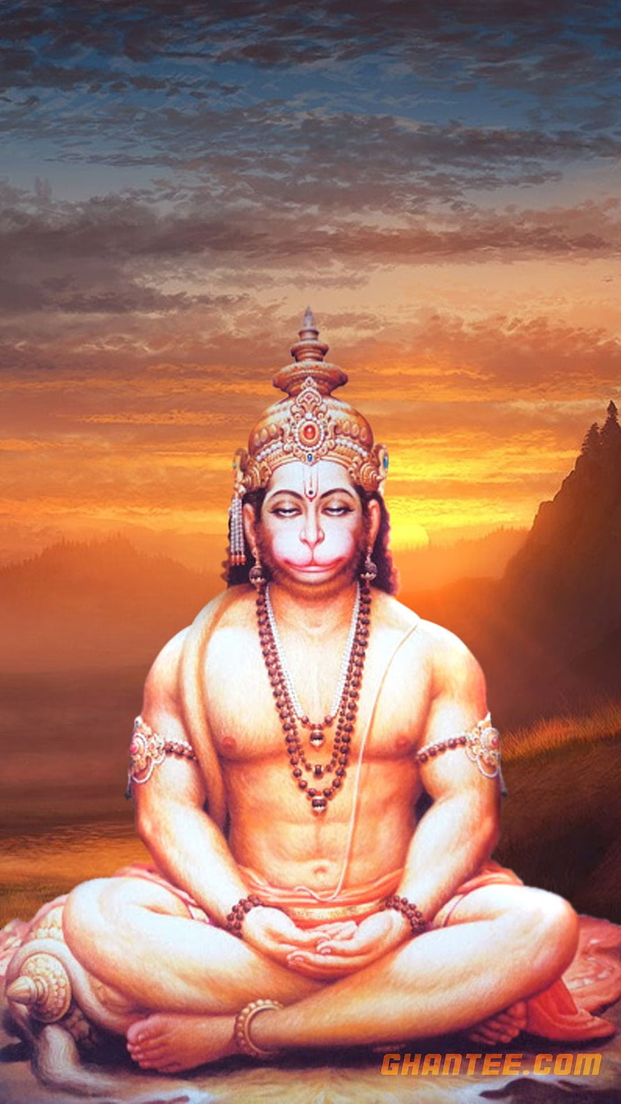 Lord Hanuman in Meditative Pose Against a Golden Sunset Sky HD phone wallpaper