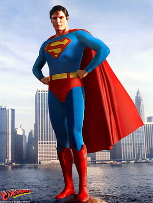 Christopher Reeve as Superman Standing on a Rooftop with City Skyline and Water in the Background HD phone wallpaper