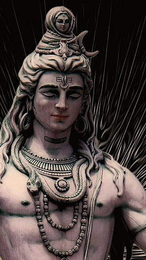 Lord Shiva Sculpture with Serpent Adornment and Serene Expression HD phone wallpaper
