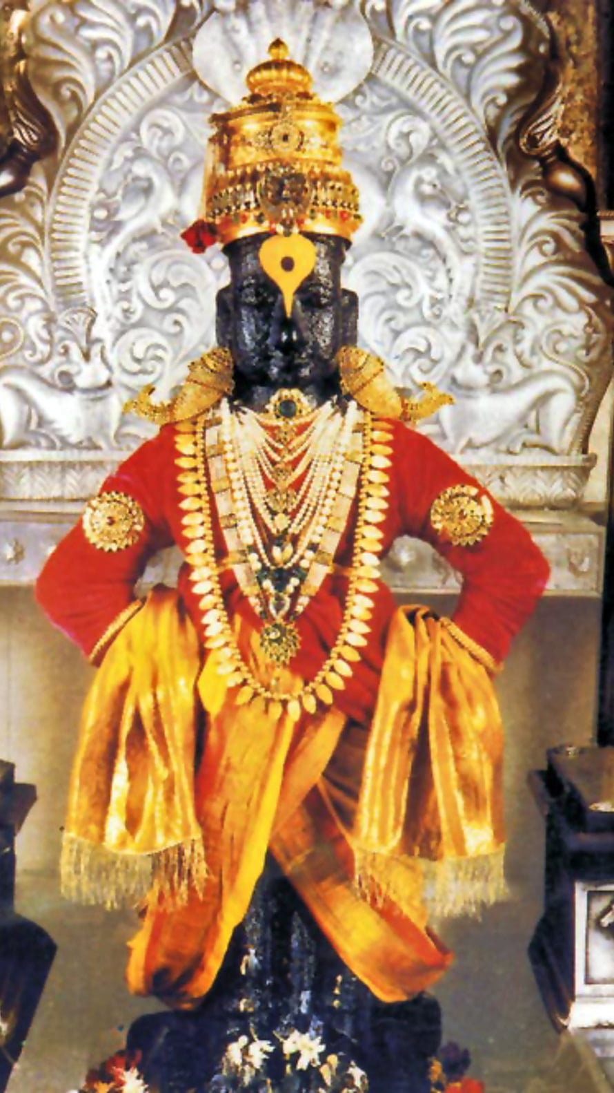 Ornate Vitthal Deity Statue Adorned in Red and Gold Temple Attire HD phone wallpaper