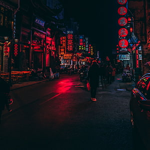 Neon-lit Chinese street at night with red lanterns and glowing signage HD phone wallpaper