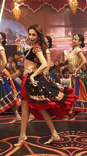 Malaika Arora performing a vibrant Bollywood dance sequence in a black and red lehenga HD phone wallpaper