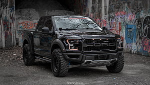 Black Ford Raptor Pickup Truck Parked in Urban Graffiti Alley HD wallpaper