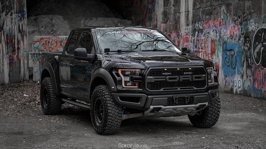 Black Ford Raptor Pickup Truck Parked in Urban Graffiti Alley HD wallpaper