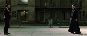 Neo and Agent Smith Confrontation in the Matrix Courtyard Scene HD wallpaper