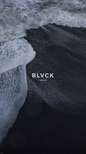 BLVCK Paris Black Sand Beach with White Ocean Foam and Dark Shoreline HD phone wallpaper