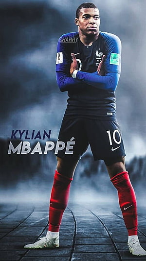 Kylian Mbappé in France National Team Kit with Dramatic Stadium Fog HD phone wallpaper