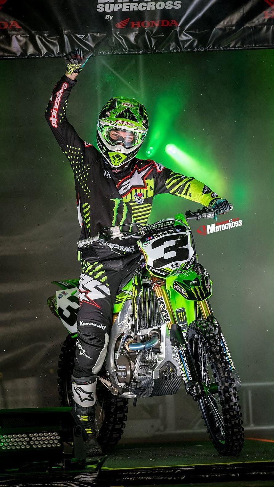 Kawasaki Monster Energy Supercross Rider Celebrating Victory on Stage HD phone wallpaper