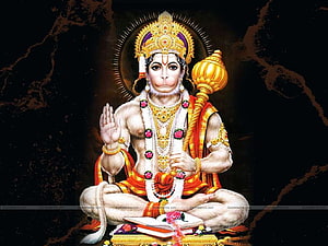 Bajrang Bali seated in meditation with golden mace and sacred text on dark background HD wallpaper