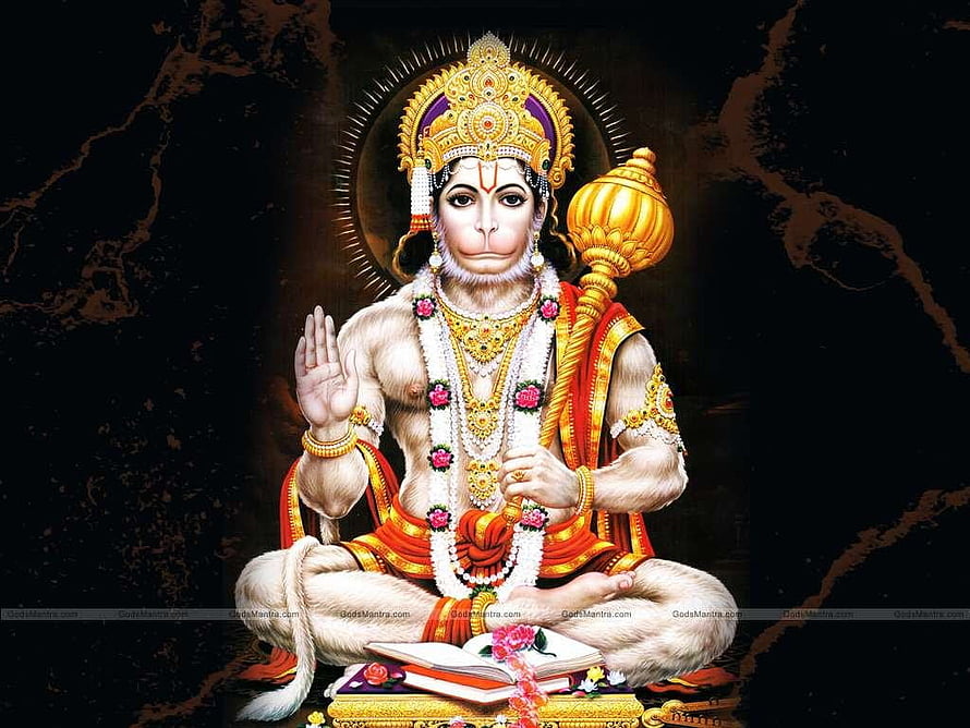 Bajrang Bali seated in meditation with golden mace and sacred text on dark background HD wallpaper