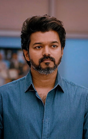 Vijay Portrait in Blue Denim Shirt with Groomed Beard and Intense Gaze HD phone wallpaper