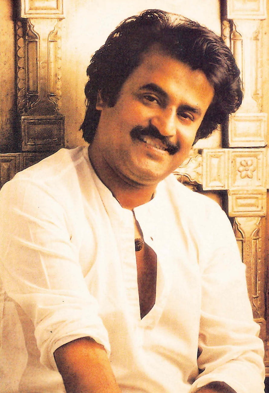 Rajinikanth Portrait in White Kurta with Ornate Carved Wooden Background HD phone wallpaper